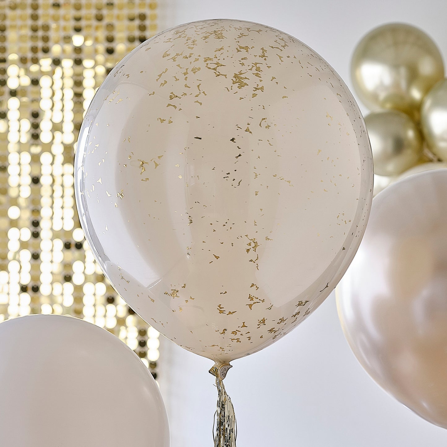 Neutral and Gold Balloons with Gold Tassel Tails