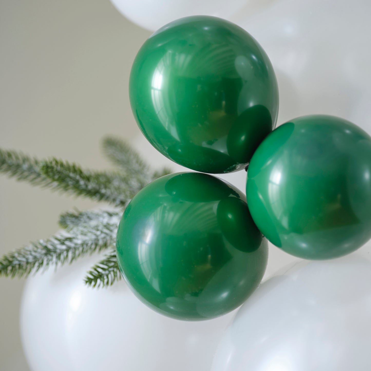 White & Dark Green Snowy Christmas Balloon Arch with Frosted Foliage